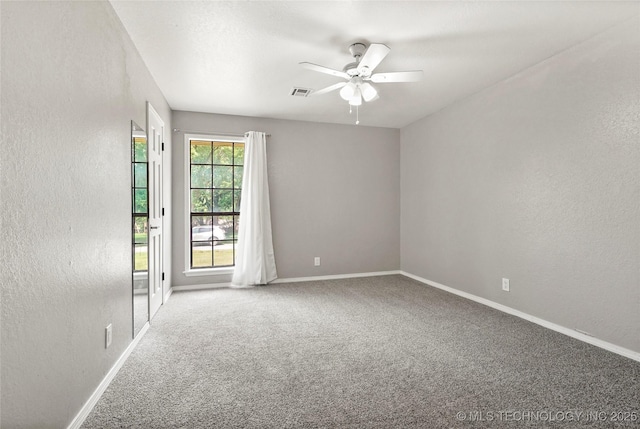 13050 S 143rd Ave E, Broken Arrow, OK 74011 - empty room featuring a textured wall, carpet, and ceiling fan