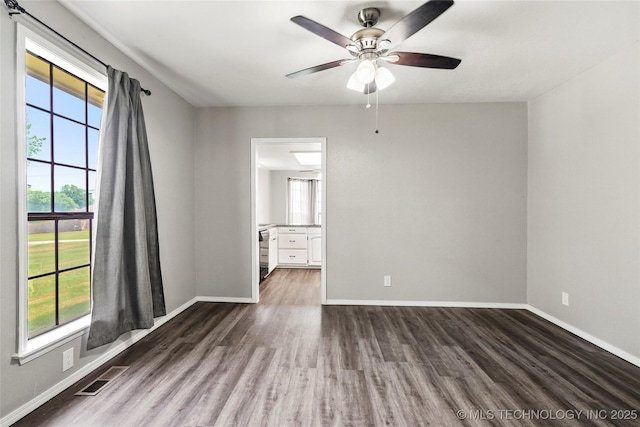 13050 S 143rd Ave E, Broken Arrow, OK 74011 - empty room featuring dark wood-type flooring and a ceiling fan