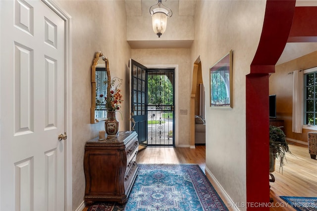 9034 S Maplewood Ave, Tulsa, OK 74137 - entrance foyer with wood finished floors and arched walkways
