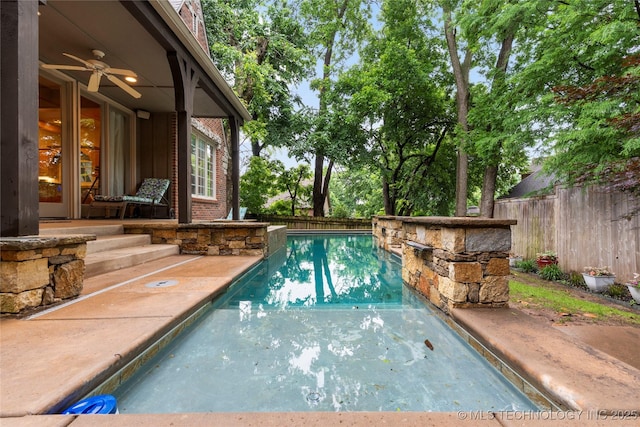 9034 S Maplewood Ave, Tulsa, OK 74137 - view of swimming pool with a fenced backyard and a ceiling fan
