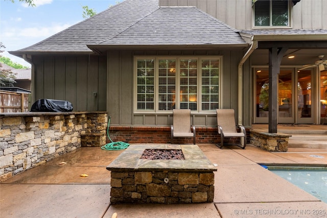 9034 S Maplewood Ave, Tulsa, OK 74137 - view of patio with a fire pit, an outdoor kitchen, and an outdoor pool