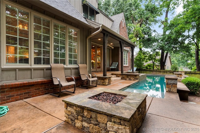 9034 S Maplewood Ave, Tulsa, OK 74137 - view of swimming pool featuring a fire pit, a patio, a fenced backyard, and french doors