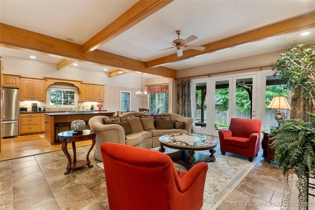 9034 S Maplewood Ave, Tulsa, OK 74137 - living area with ceiling fan, beamed ceiling, a chandelier, recessed lighting, and light stone finish floors