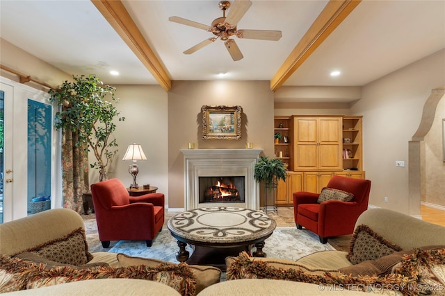 9034 S Maplewood Ave, Tulsa, OK 74137 - living room featuring beamed ceiling, a lit fireplace, a ceiling fan, and recessed lighting