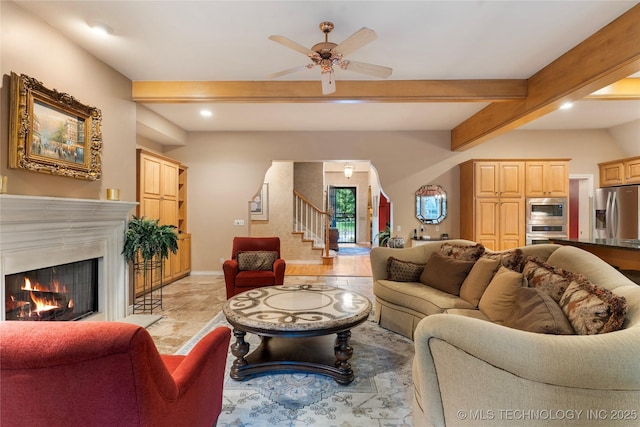 9034 S Maplewood Ave, Tulsa, OK 74137 - living area with beamed ceiling, recessed lighting, stairway, a warm lit fireplace, and ceiling fan