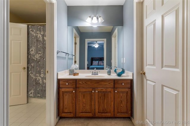 9034 S Maplewood Ave, Tulsa, OK 74137 - ensuite bathroom with vanity, tile patterned floors, and ceiling fan