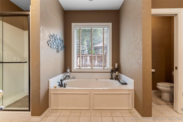 9034 S Maplewood Ave, Tulsa, OK 74137 - full bath featuring a textured wall, a garden tub, a stall shower, and tile patterned flooring