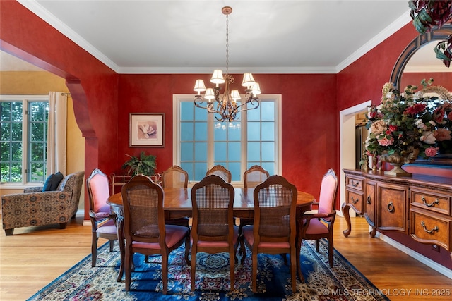 9034 S Maplewood Ave, Tulsa, OK 74137 - dining room with a chandelier, wood finished floors, and crown molding