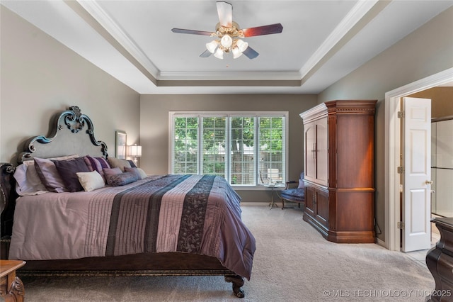 9034 S Maplewood Ave, Tulsa, OK 74137 - bedroom featuring a raised ceiling, light carpet, ornamental molding, and a ceiling fan
