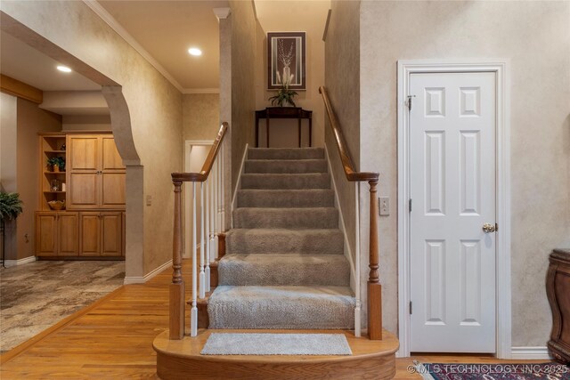 9034 S Maplewood Ave, Tulsa, OK 74137 - stairs with wood finished floors, recessed lighting, and crown molding
