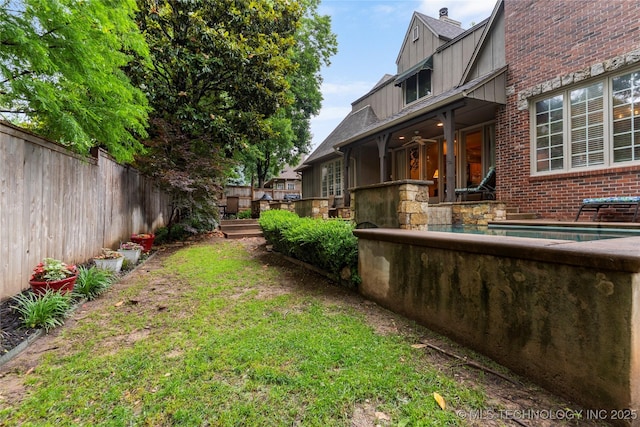 9034 S Maplewood Ave, Tulsa, OK 74137 - fenced yard with ceiling fan