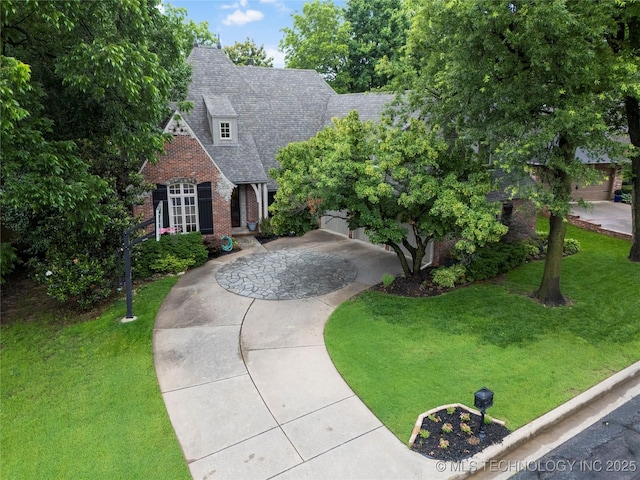 9034 S Maplewood Ave, Tulsa, OK 74137 - view of front of house with brick siding, a front yard, and a shingled roof