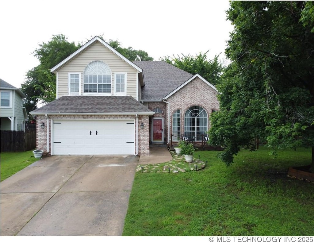 4514 W Toledo Ct, Broken Arrow, OK 74012 - traditional home featuring brick siding, a front lawn, a garage, concrete driveway, and roof with shingles