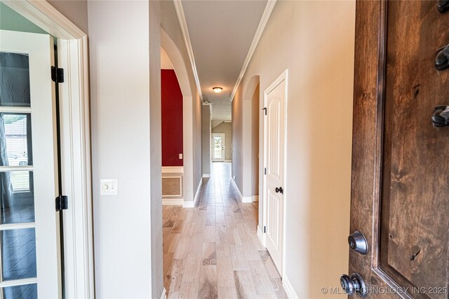 18312 E 46th St, Tulsa, OK 74134 - hall with arched walkways, ornamental molding, and light wood-style floors