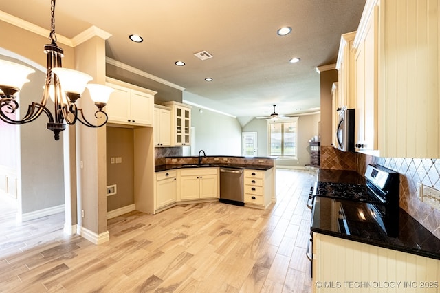 18312 E 46th St, Tulsa, OK 74134 - kitchen featuring stainless steel appliances, a peninsula, crown molding, recessed lighting, and backsplash