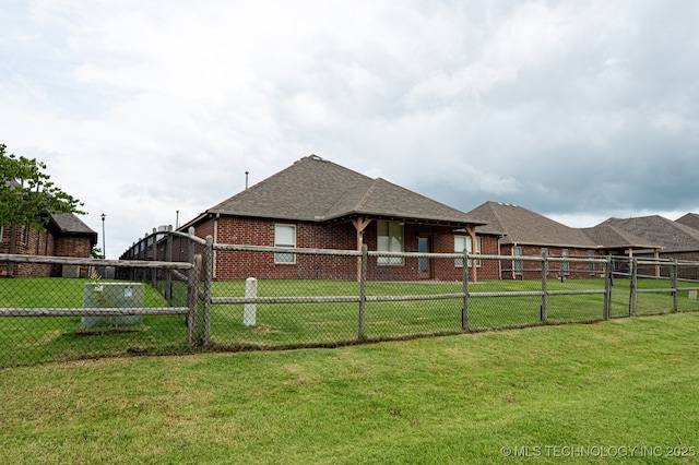18312 E 46th St, Tulsa, OK 74134 - view of property exterior featuring a shingled roof and brick siding