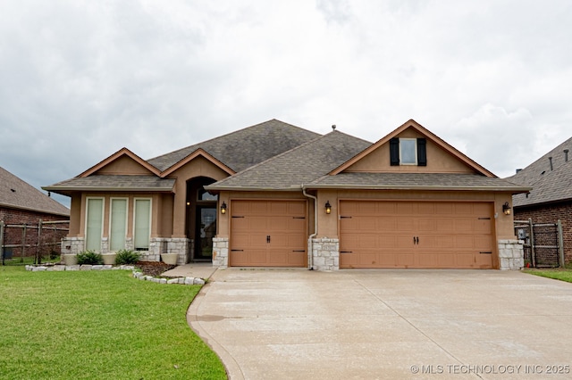 18312 E 46th St, Tulsa, OK 74134 - view of front of property featuring a garage, stone siding, concrete driveway, roof with shingles, and stucco siding