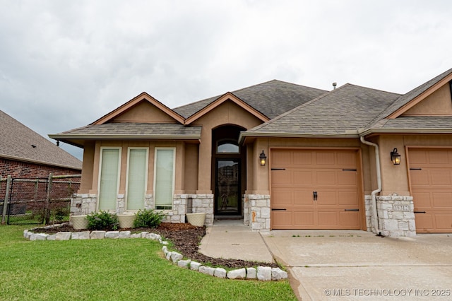 18312 E 46th St, Tulsa, OK 74134 - view of front of house featuring stone siding, an attached garage, roof with shingles, and driveway