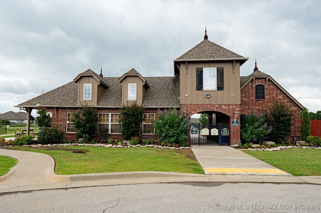 18312 E 46th St, Tulsa, OK 74134 - view of front of property featuring brick siding, a gate, roof with shingles, and board and batten siding
