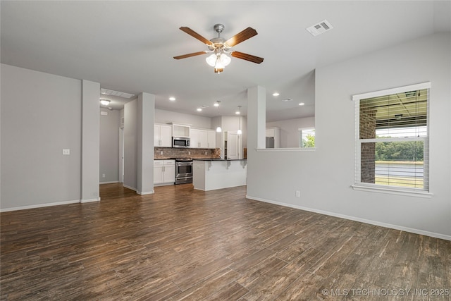 10387 S Nathan St, Jenks, OK 74037 - unfurnished living room with ceiling fan, dark wood-style floors, and recessed lighting