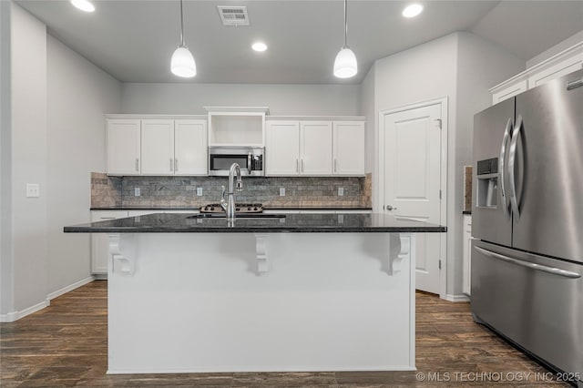 10387 S Nathan St, Jenks, OK 74037 - kitchen with stainless steel appliances, decorative backsplash, white cabinetry, a center island with sink, and recessed lighting