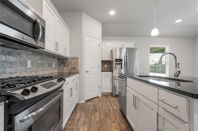 10387 S Nathan St, Jenks, OK 74037 - kitchen with stainless steel appliances, dark wood-type flooring, white cabinets, backsplash, and recessed lighting