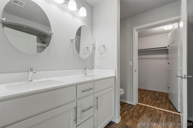 10387 S Nathan St, Jenks, OK 74037 - full bath with wood finished floors, double vanity, and a spacious closet
