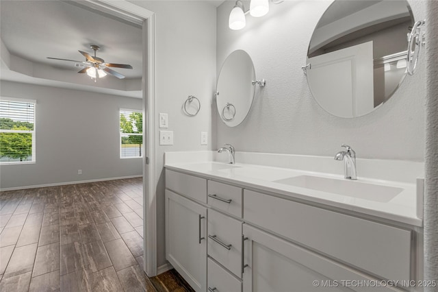 10387 S Nathan St, Jenks, OK 74037 - bathroom with plenty of natural light, a ceiling fan, double vanity, and wood finished floors