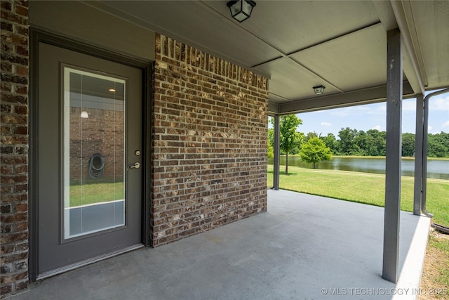 10387 S Nathan St, Jenks, OK 74037 - view of patio / terrace with a water view and view of scattered trees
