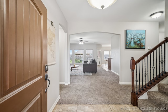1620 E Boston Ct, Broken Arrow, OK 74012 - entryway featuring arched walkways, light carpet, and ceiling fan