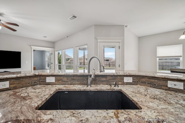 1620 E Boston Ct, Broken Arrow, OK 74012 - kitchen featuring open floor plan, light stone counters, plenty of natural light, and ceiling fan