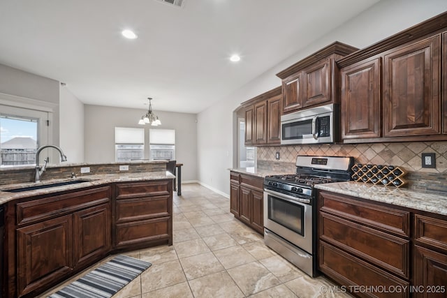 1620 E Boston Ct, Broken Arrow, OK 74012 - kitchen featuring stainless steel appliances, tasteful backsplash, healthy amount of natural light, and recessed lighting
