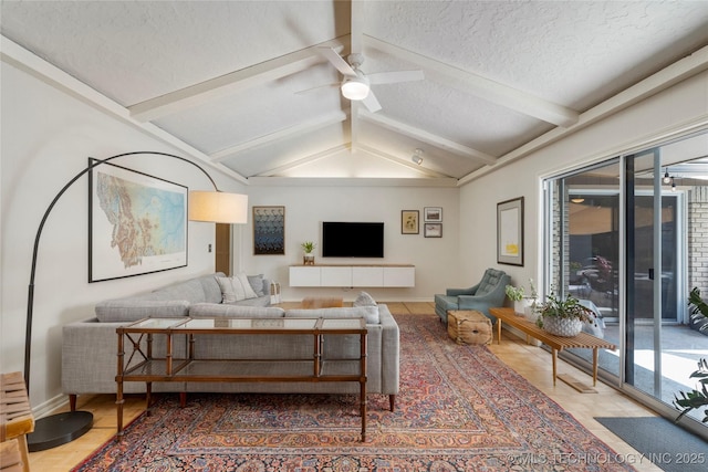 2962 E 56th Ct, Tulsa, OK 74105 - tiled living room featuring plenty of natural light, a ceiling fan, and a textured ceiling