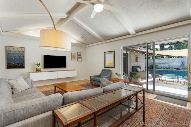 2962 E 56th Ct, Tulsa, OK 74105 - living room featuring a ceiling fan and a textured ceiling