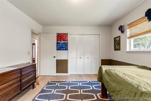 2962 E 56th Ct, Tulsa, OK 74105 - bedroom featuring wood finished floors and a closet