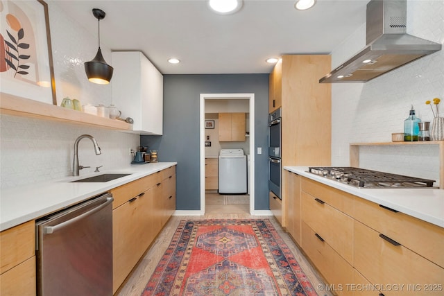 2962 E 56th Ct, Tulsa, OK 74105 - kitchen with stainless steel appliances, wall chimney exhaust hood, washer / clothes dryer, light brown cabinets, and open shelves