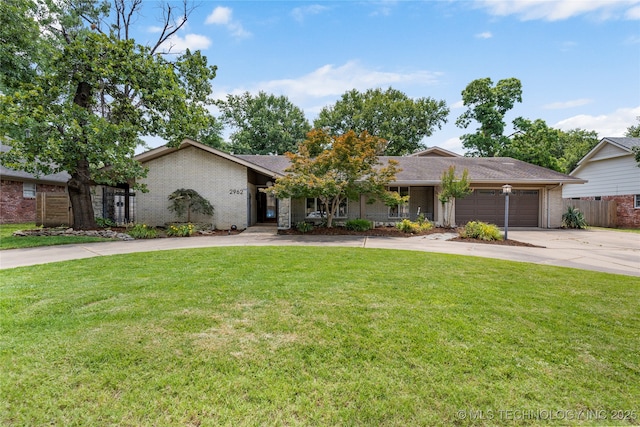 2962 E 56th Ct, Tulsa, OK 74105 - view of front of property with driveway, brick siding, an attached garage, and covered porch