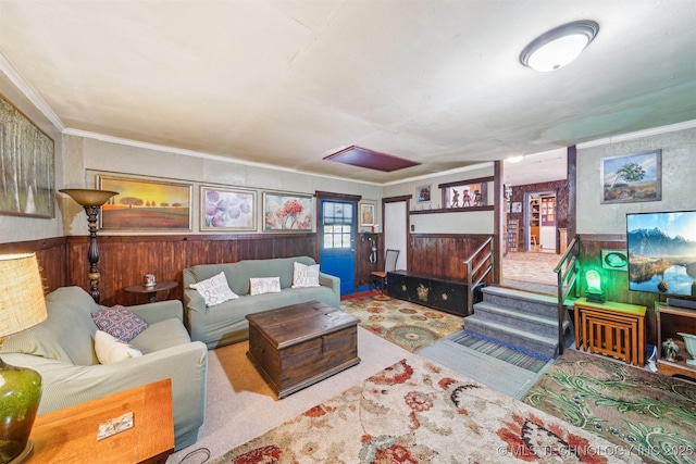 1608 E 56th St N, Tulsa, OK 74126 - living room with wood walls, ornamental molding, a wainscoted wall, and carpet floors