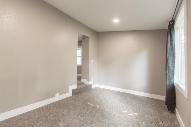 812 N Delaware Pl, Tulsa, OK 74110 - carpeted spare room with baseboards and recessed lighting