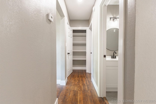 812 N Delaware Pl, Tulsa, OK 74110 - corridor featuring wood finished floors and a textured wall