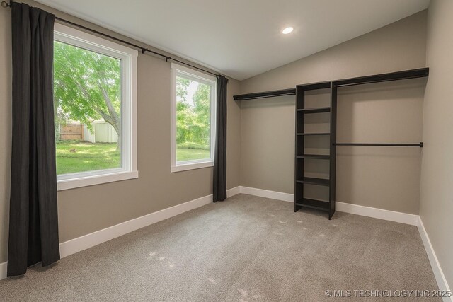 812 N Delaware Pl, Tulsa, OK 74110 - unfurnished bedroom with vaulted ceiling, light carpet, and recessed lighting