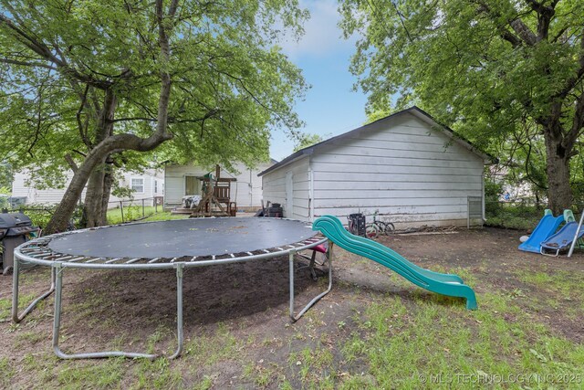2820 W Okmulgee, Muskogee, OK 74401 - view of yard with a trampoline and a playground
