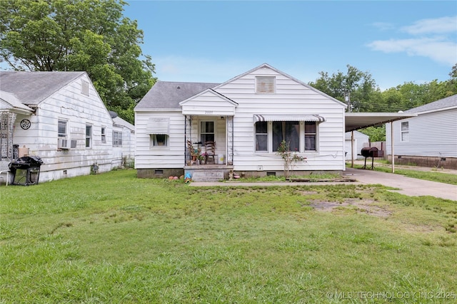2820 W Okmulgee, Muskogee, OK 74401 - view of front of home featuring crawl space, driveway, a front yard, and an attached carport