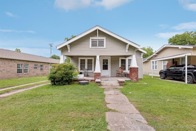 2820 W Okmulgee, Muskogee, OK 74401 - view of front of house featuring covered porch and a front lawn
