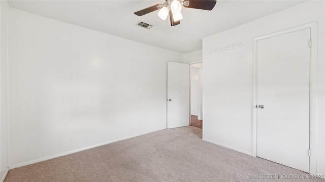 702 E Elgin Pl, Broken Arrow, OK 74012 - unfurnished bedroom featuring carpet floors and a ceiling fan
