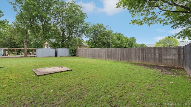 702 E Elgin Pl, Broken Arrow, OK 74012 - fenced backyard featuring a shed