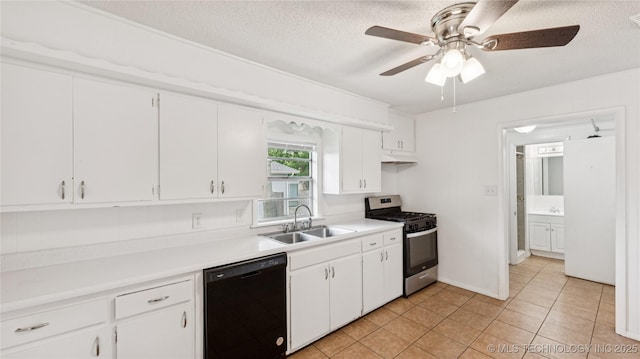 702 E Elgin Pl, Broken Arrow, OK 74012 - kitchen with black dishwasher, stainless steel gas range, under cabinet range hood, light countertops, and freestanding refrigerator