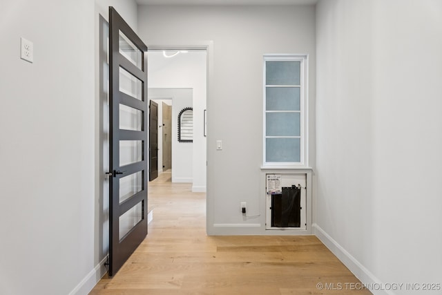 12622 S Granite Ave E, Bixby, OK 74008 - hall with light wood finished floors and french doors