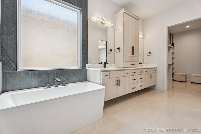 12622 S Granite Ave E, Bixby, OK 74008 - full bath featuring double vanity, a freestanding bath, plenty of natural light, and a walk in closet