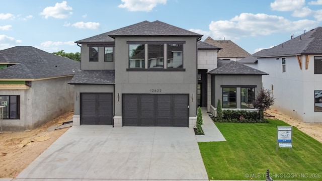 12622 S Granite Ave E, Bixby, OK 74008 - view of front facade with roof with shingles, an attached garage, driveway, a front lawn, and stucco siding